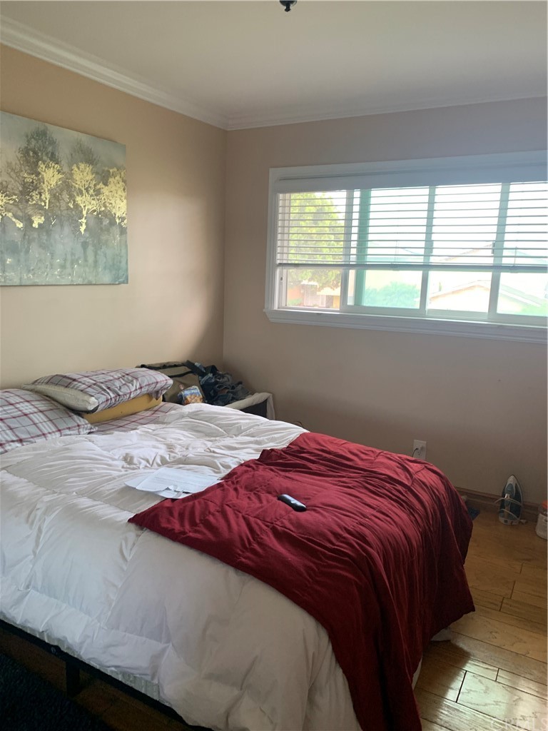 23625 Pineforest Lane Harbor City, CA 90710 - Photo 11 of 22 a bedroom with a bed and a window