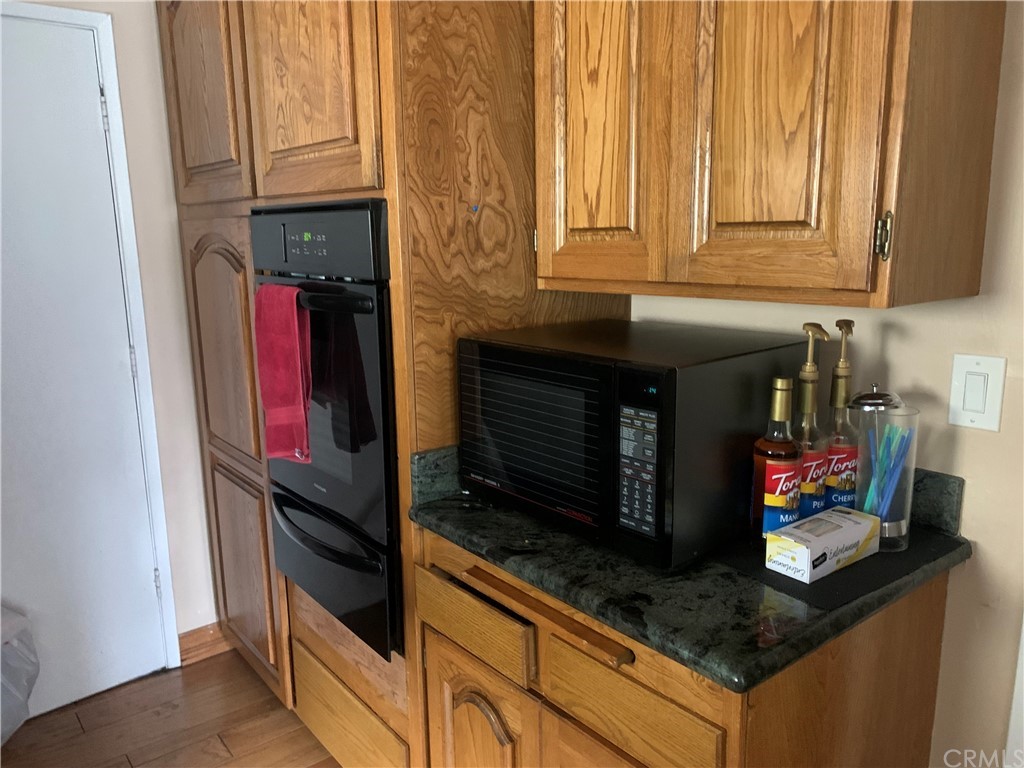 23625 Pineforest Lane Harbor City, CA 90710 - Photo 3 of 22 a kitchen with stainless steel appliances granite countertop a stove and a microwave