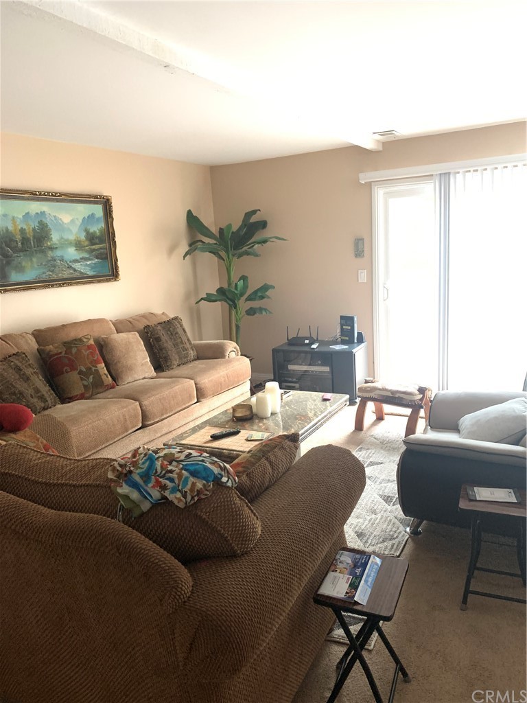 23625 Pineforest Lane Harbor City, CA 90710 - Photo 7 of 22 a living room with furniture and a large window