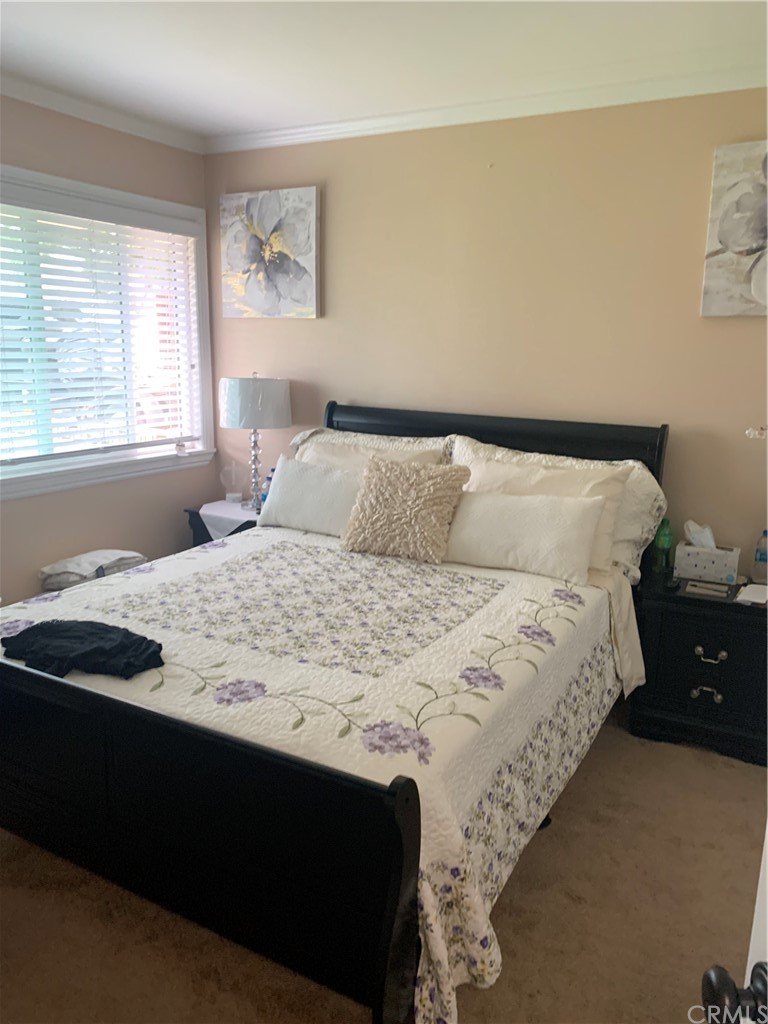 23625 Pineforest Lane Harbor City, CA 90710 - Photo 10 of 22 a bedroom with a bed and a window