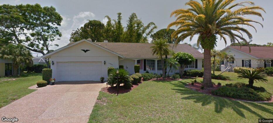 1055 Mohawk Road Venice, FL 34293 - Photo 1 of 1 a front view of house with yard and trees around