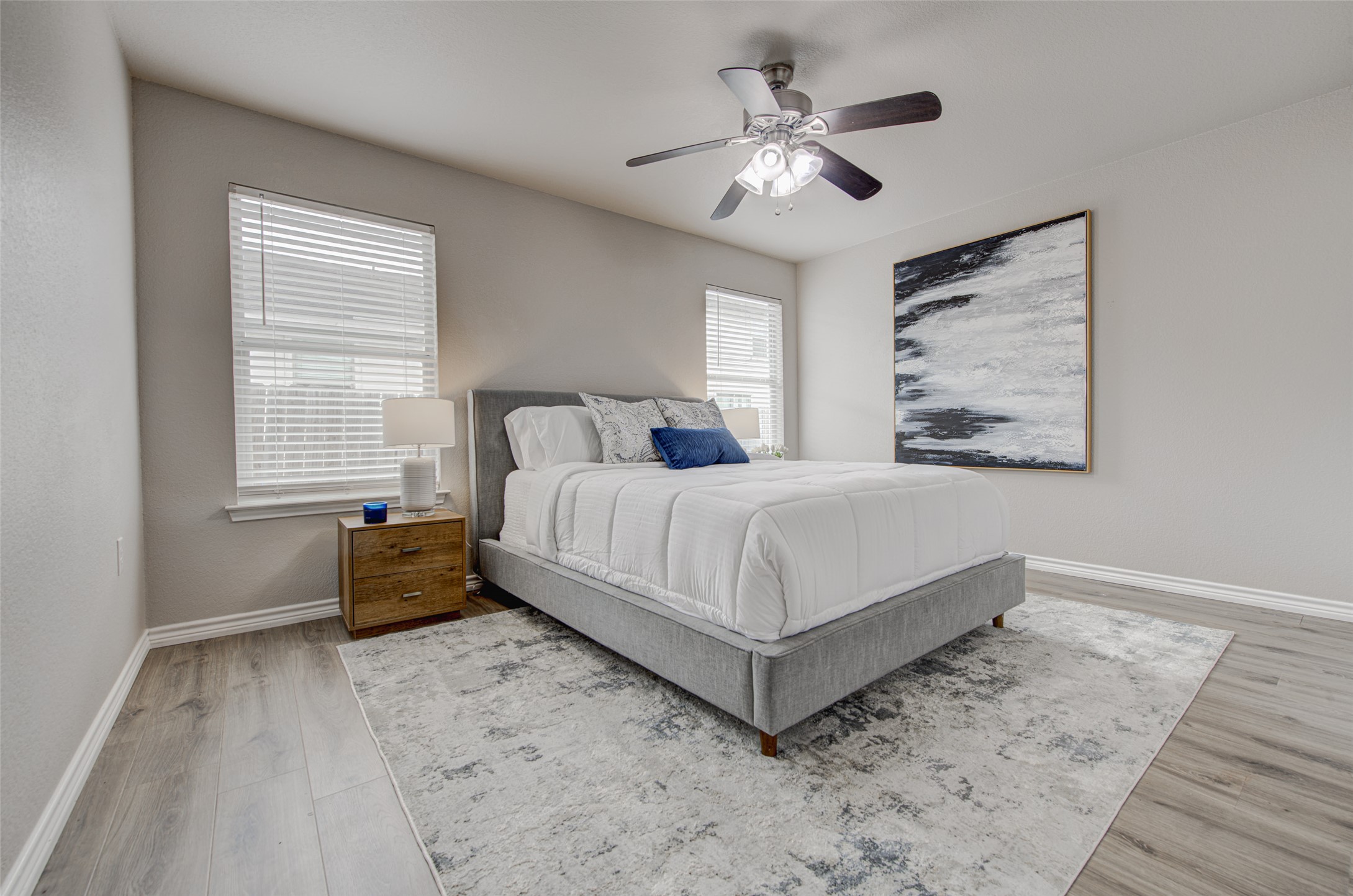 6709 Doyal Drive Austin, TX 78747 - Photo 17 of 22 Bedroom featuring a ceiling fan and light wood finished floors