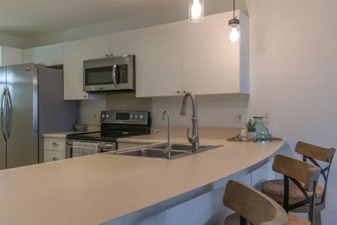 a room with dining table and chairs