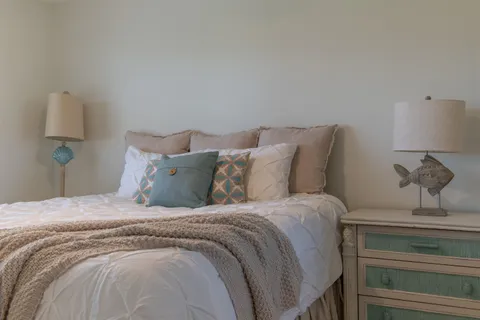 a large white bed in a white room