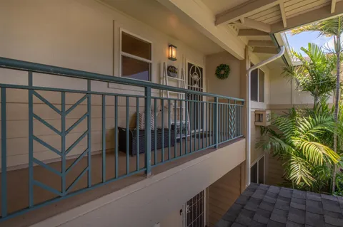 a view of balcony with furniture