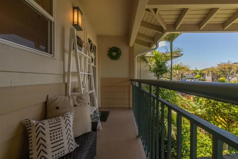 a kitchen with a table chairs and a refrigerator