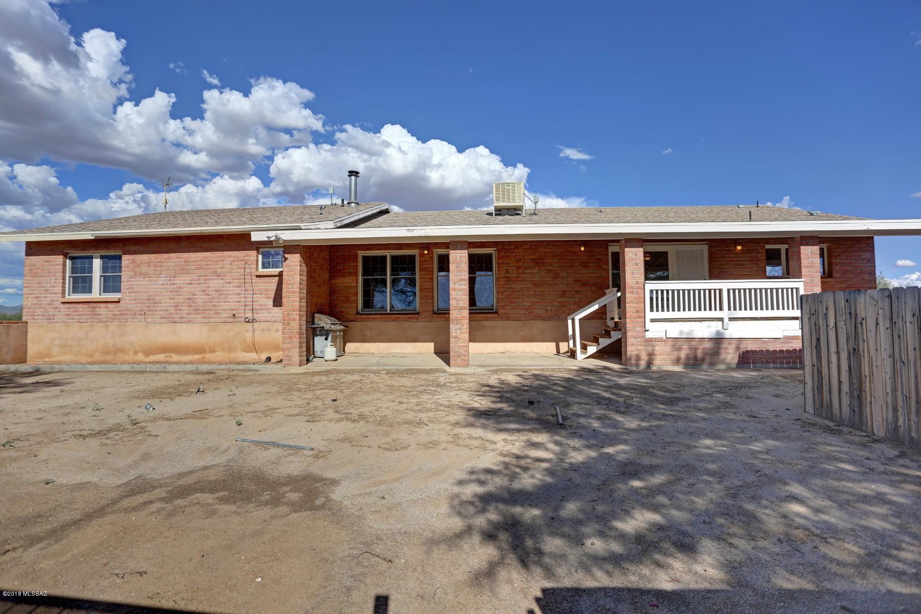 5851 South Avra Road Tucson, AZ 85735 - Photo 40 of 46 front view of a house with a view of a house