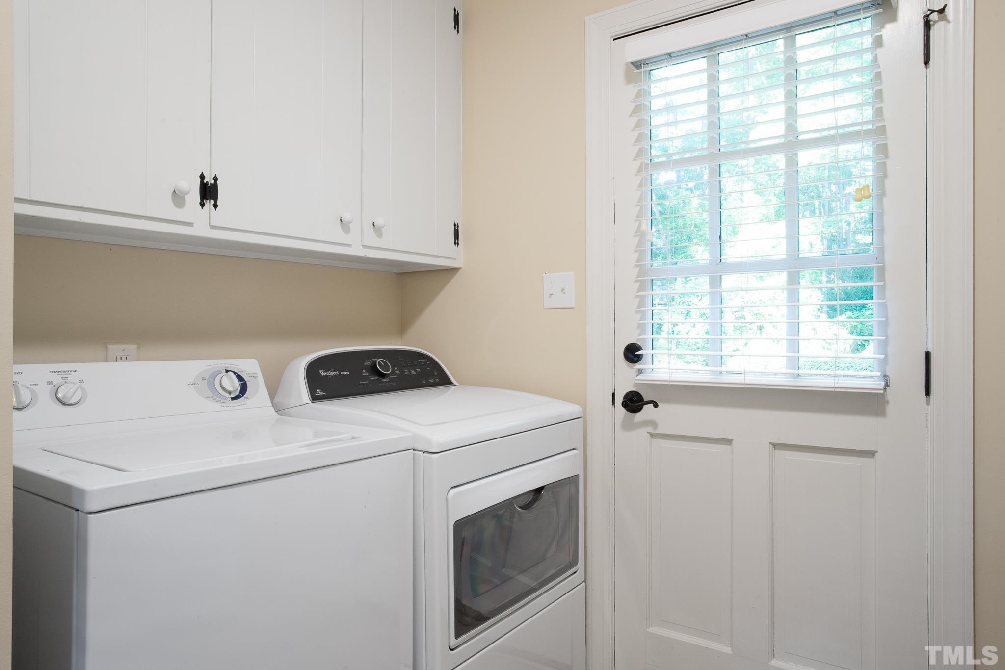7301 Tanbark Way Raleigh, NC 27615 - Photo 23 of 36 a utility room with dryer and washer
