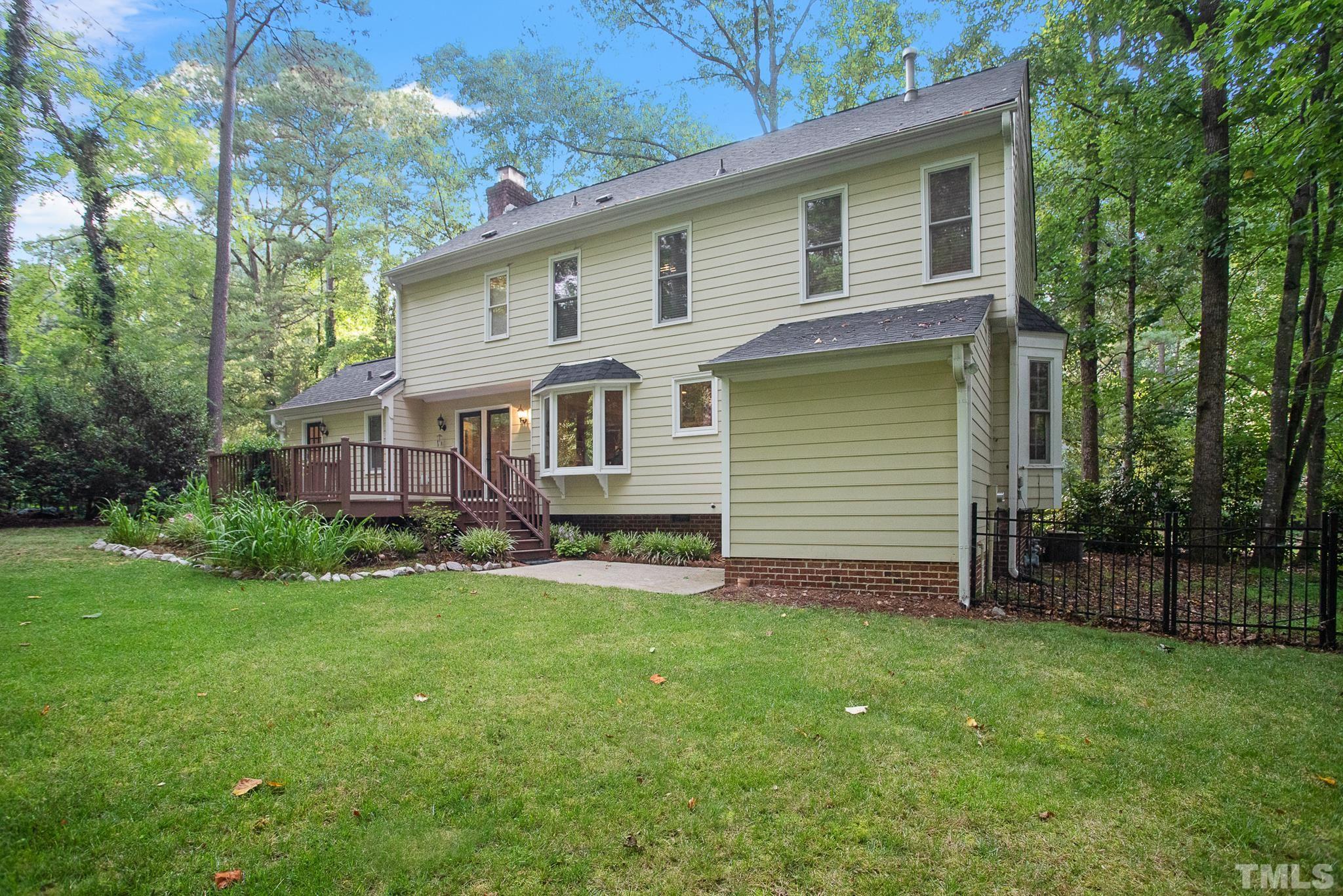 7301 Tanbark Way Raleigh, NC 27615 - Photo 33 of 36 front view of a house with a yard