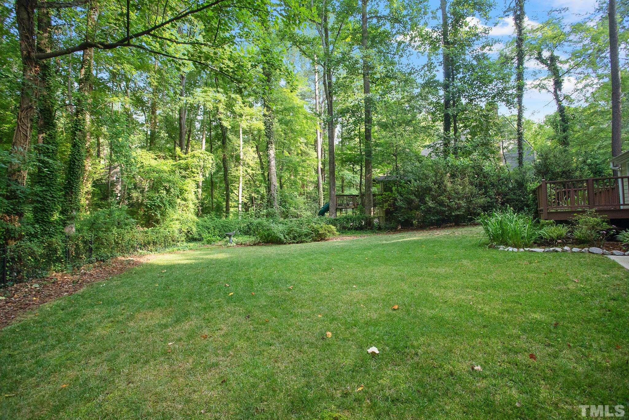 7301 Tanbark Way Raleigh, NC 27615 - Photo 34 of 36 a view of a lush green space