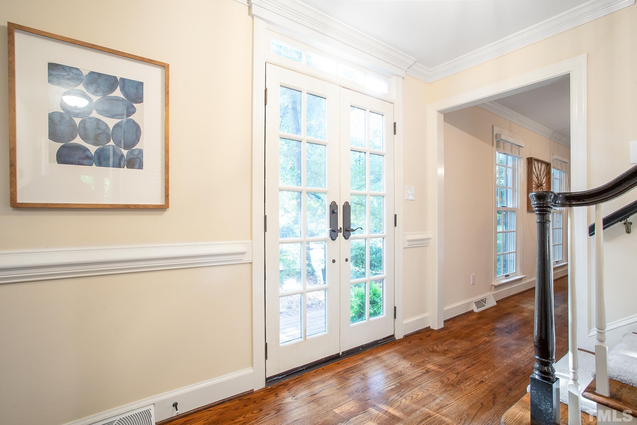 7301 Tanbark Way Raleigh, NC 27615 - Photo 4 of 36 a view of a hallway with interior of the house