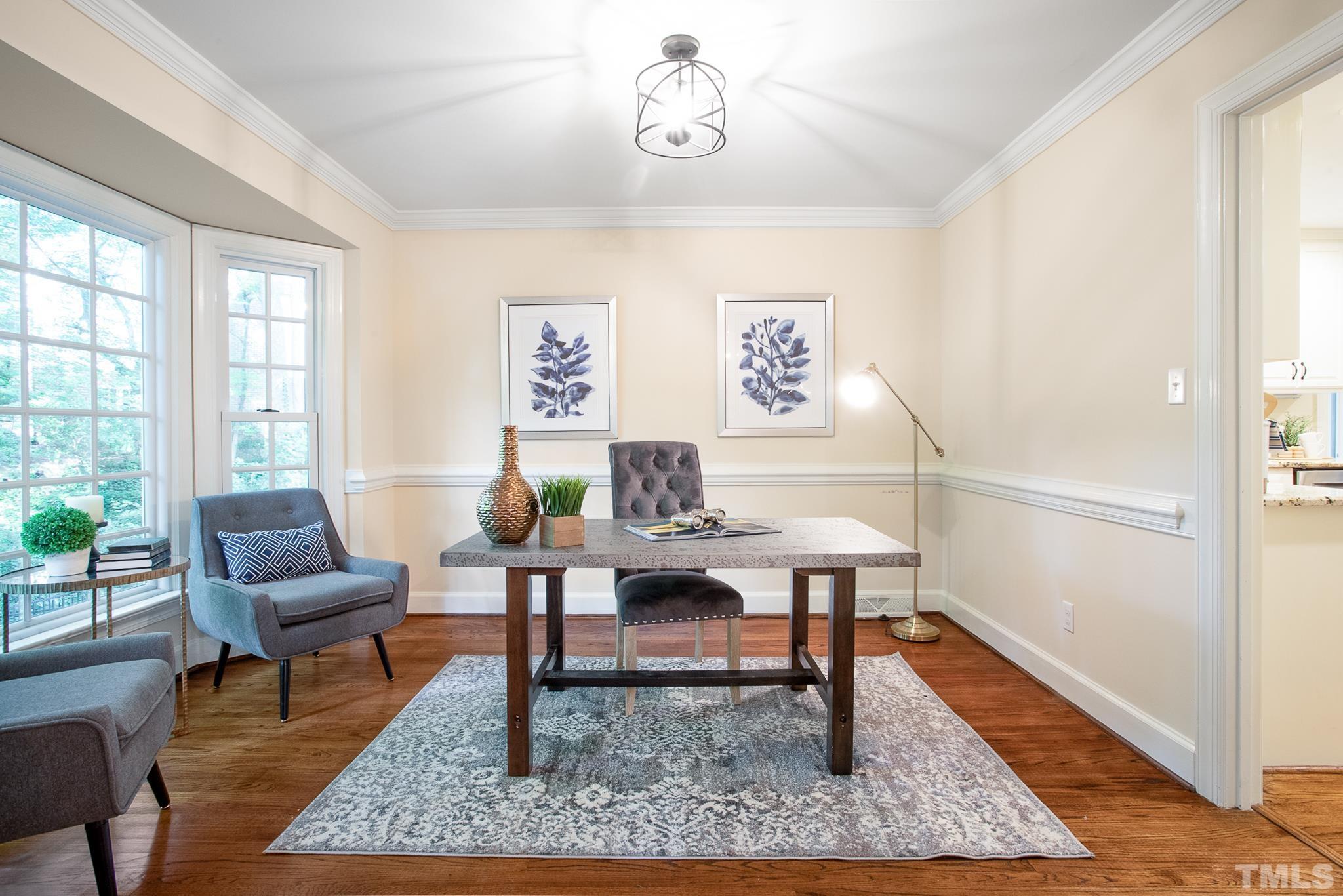 7301 Tanbark Way Raleigh, NC 27615 - Photo 6 of 36 a view of a livingroom with furniture and wooden floor