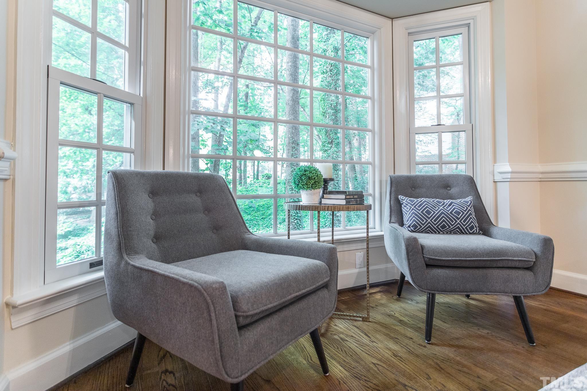 7301 Tanbark Way Raleigh, NC 27615 - Photo 8 of 36 a living room with furniture and a window