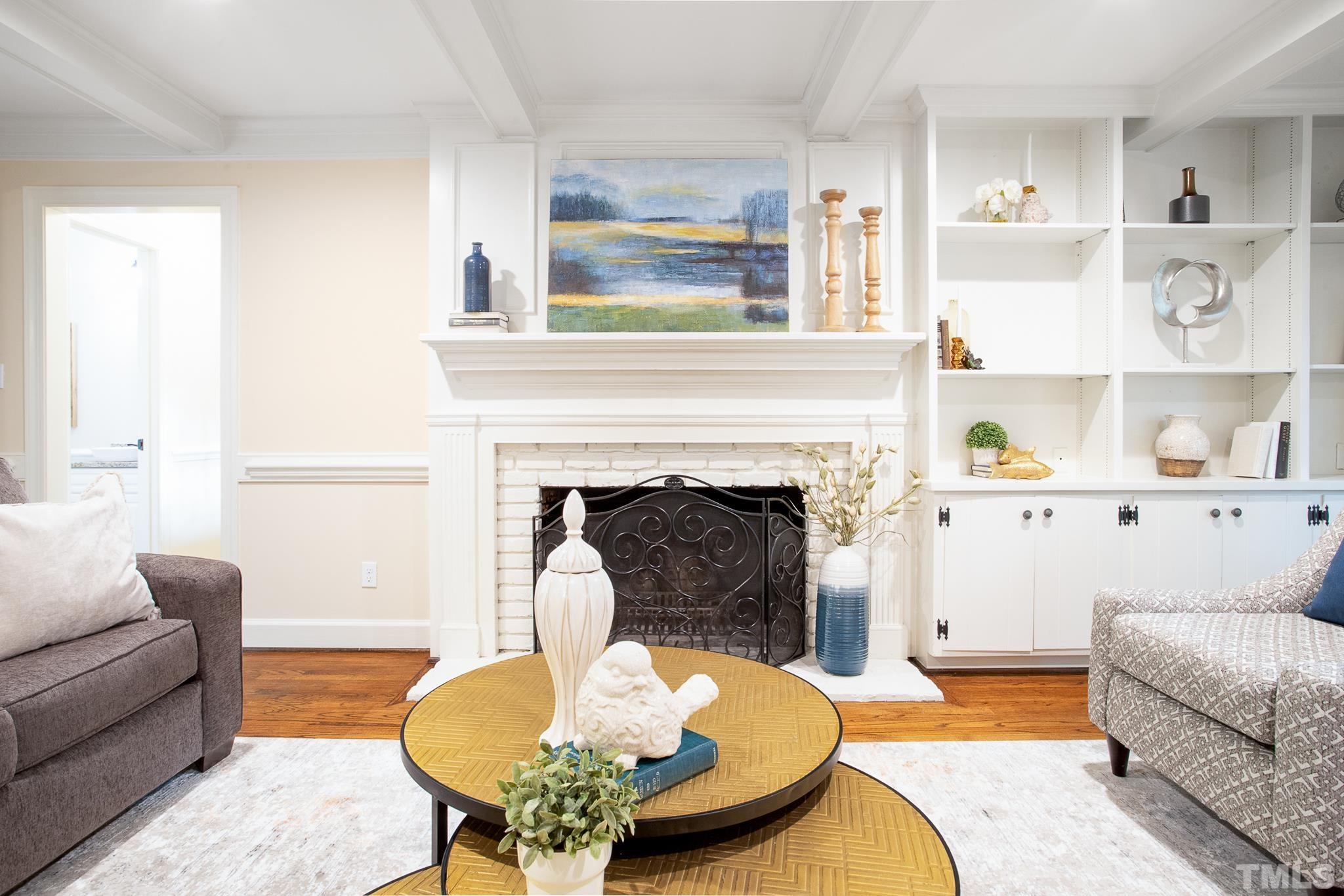 7301 Tanbark Way Raleigh, NC 27615 - Photo 10 of 36 a living room with furniture and a fireplace