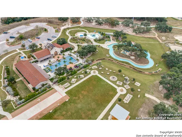 a view of a swimming pool with a yard