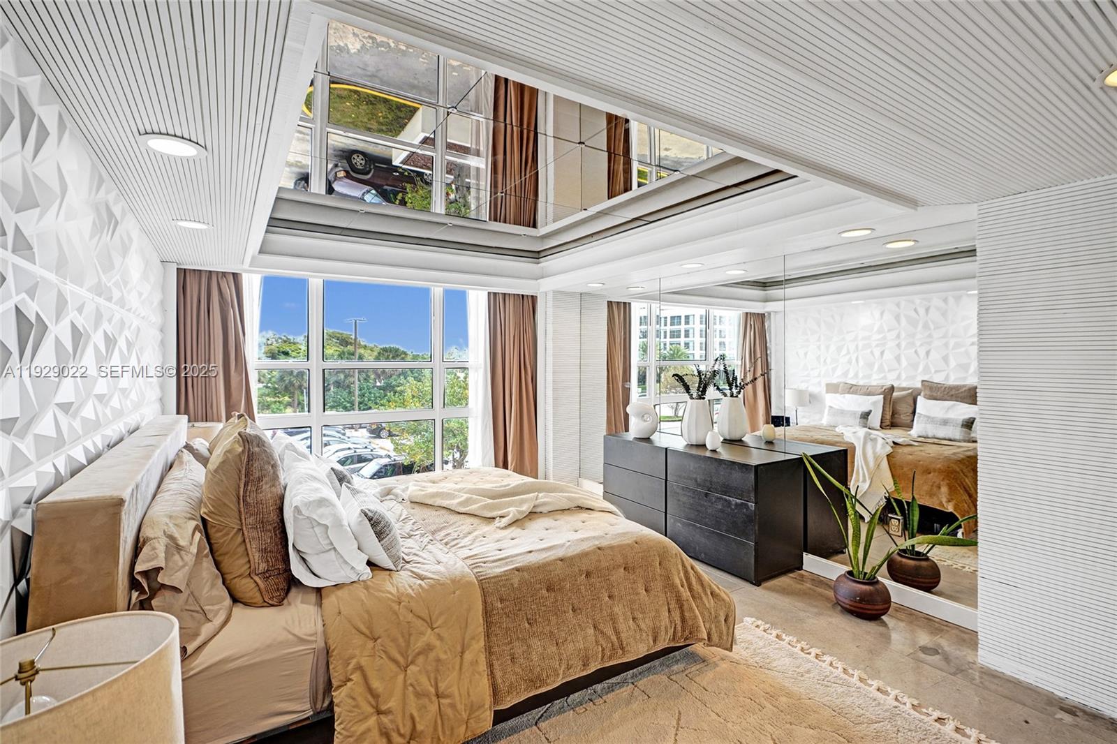 600 Northeast 36th Street, Unit 218 Miami, FL 33137 - Photo 4 of 31 a bed sitting in a bedroom next to a window