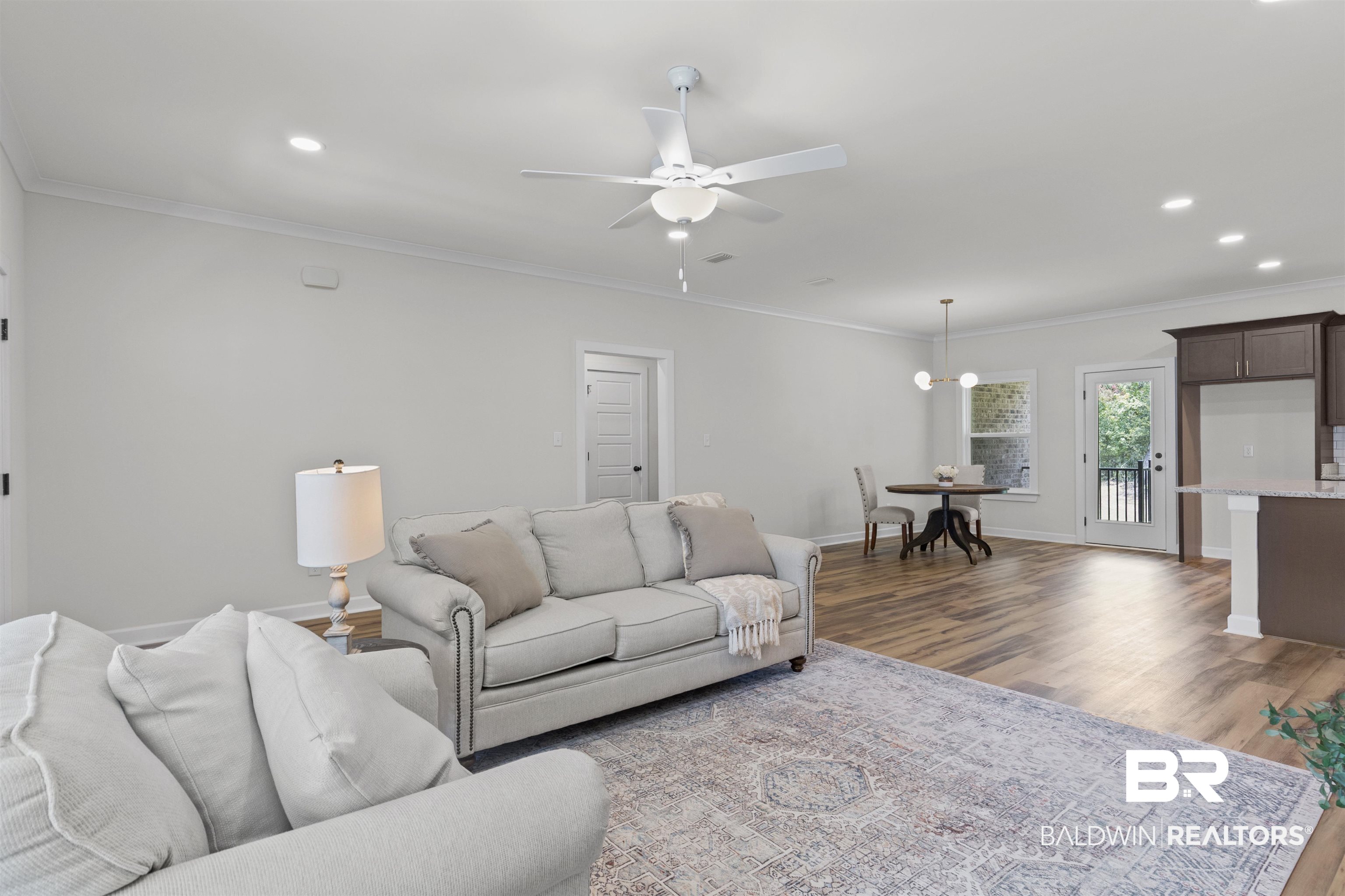 8760 Floyd Crabtree Way Semmes, AL 36575 - Photo 2 of 38 Open-concept living area with wood-finish flooring, recessed lighting, and a ceiling fan