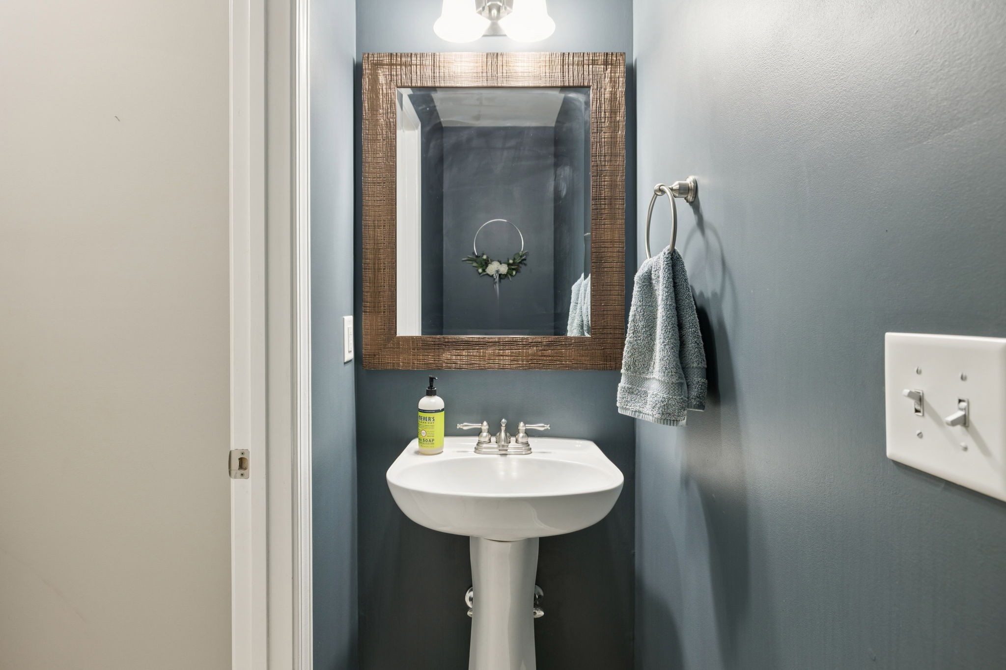 1062 Golf View Way Spring Hill, TN 37174 - Photo 20 of 42 a bathroom with a sink and a mirror