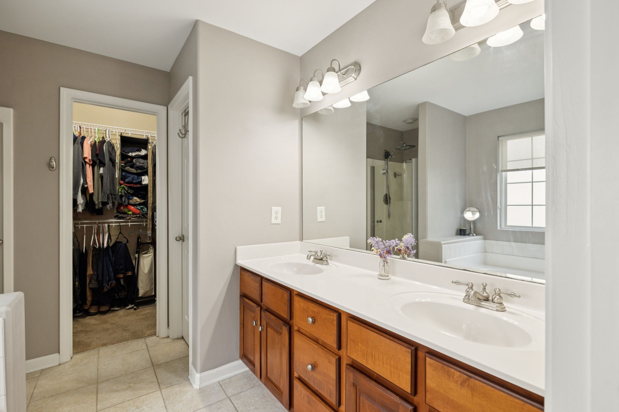 1062 Golf View Way Spring Hill, TN 37174 - Photo 23 of 42 a bathroom with a sink double vanity and a mirror