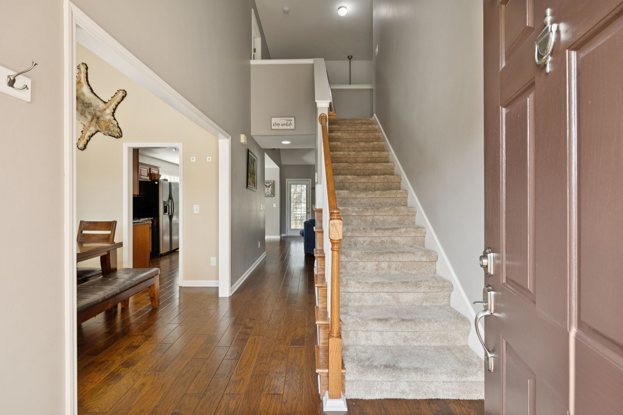 1062 Golf View Way Spring Hill, TN 37174 - Photo 27 of 42 a view of a hallway with wooden floor and staircase