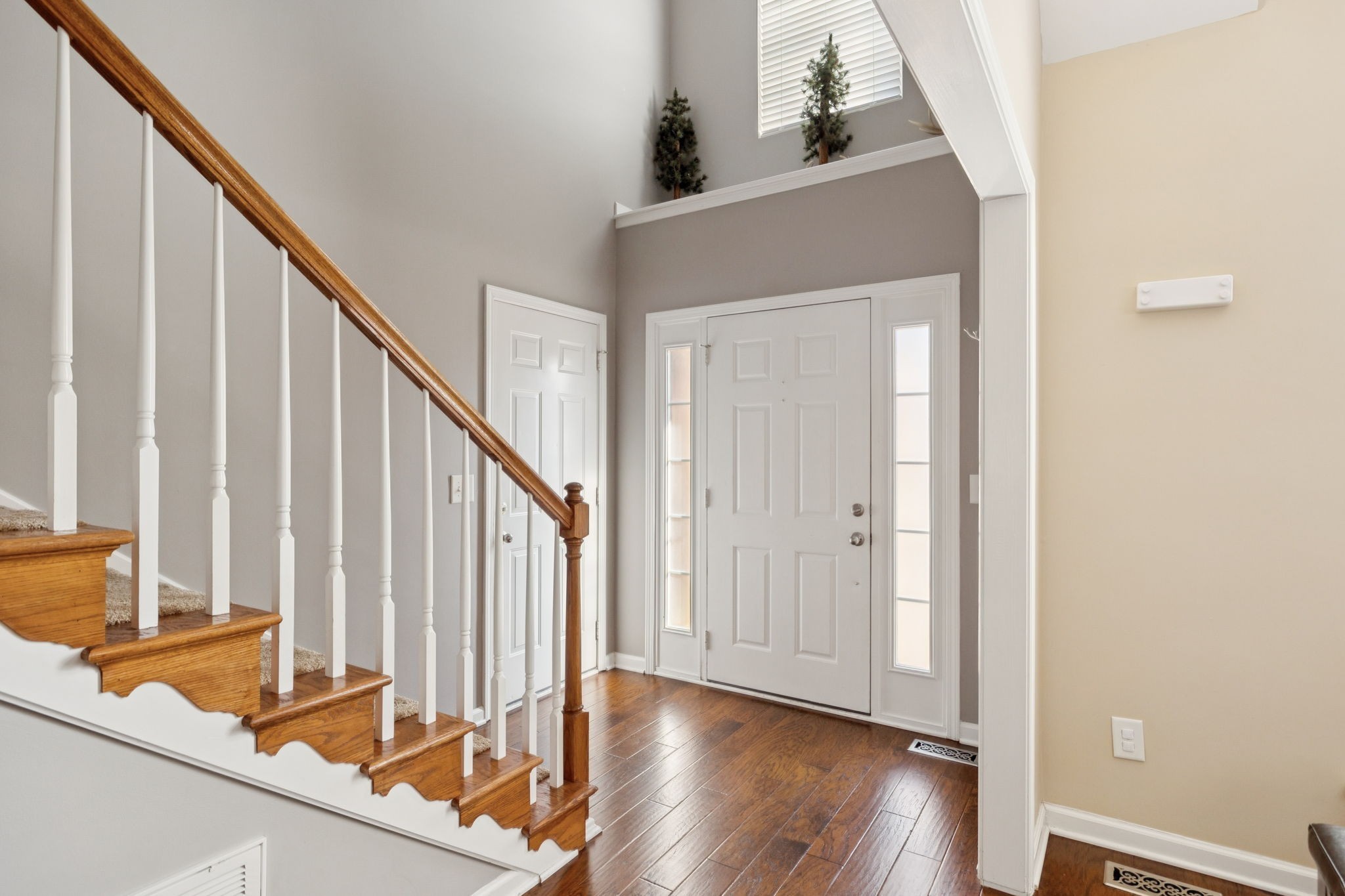 1062 Golf View Way Spring Hill, TN 37174 - Photo 34 of 42 a view of a hallway with wooden floor and staircase