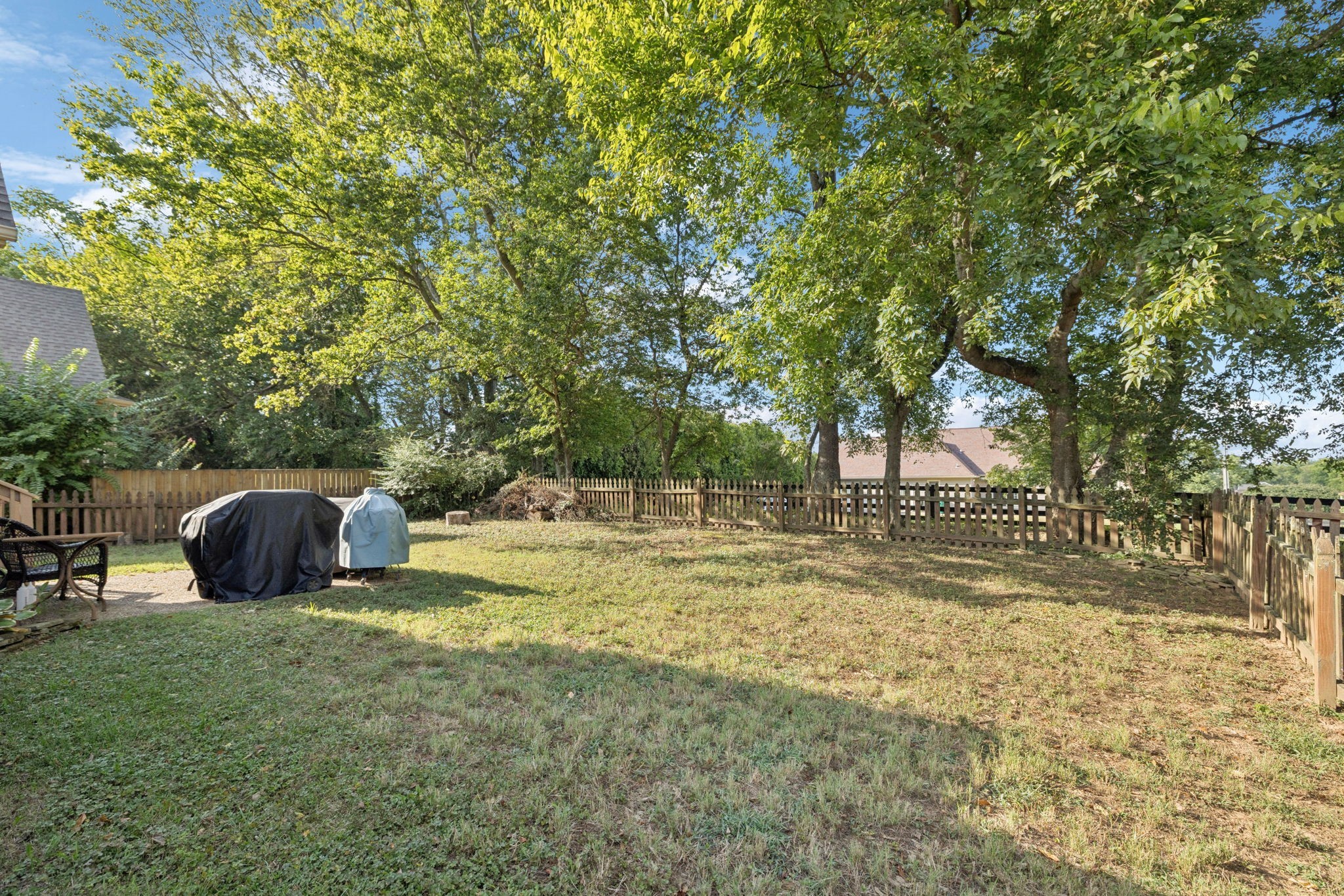 1062 Golf View Way Spring Hill, TN 37174 - Photo 38 of 42 a view of a backyard with large trees