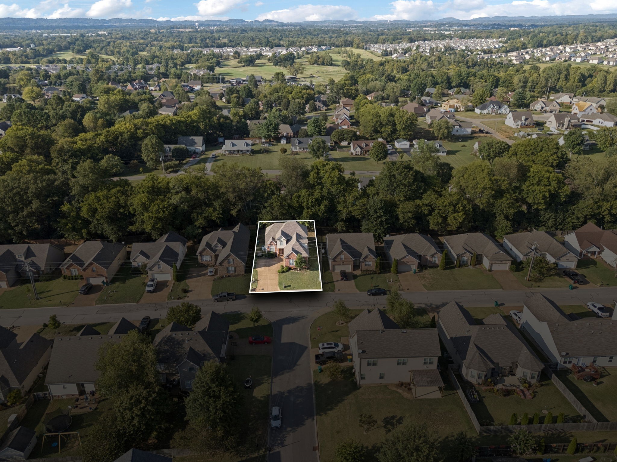 1062 Golf View Way Spring Hill, TN 37174 - Photo 40 of 42 an aerial view of a city with lots of residential buildings