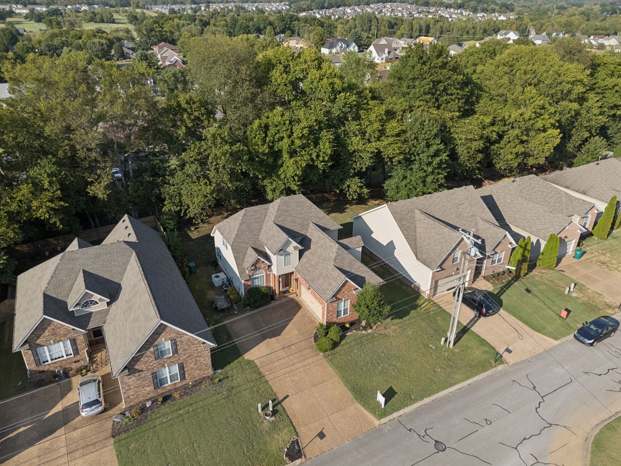 1062 Golf View Way Spring Hill, TN 37174 - Photo 42 of 42 an aerial view of a house with a yard and parking