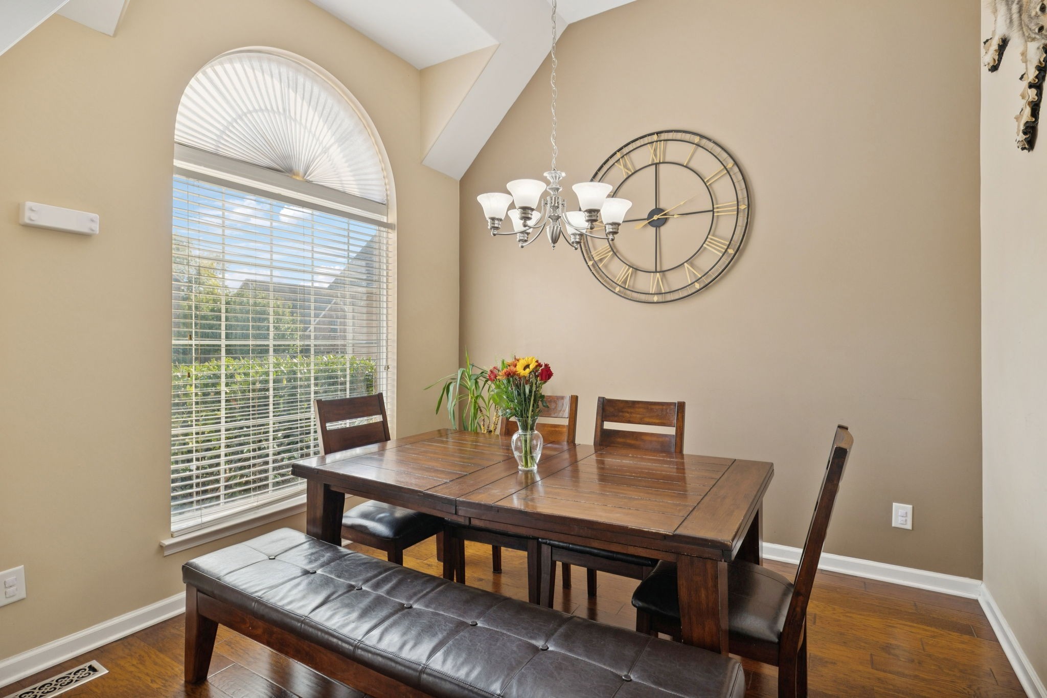 1062 Golf View Way Spring Hill, TN 37174 - Photo 6 of 42 a view of a dining room with furniture a chandelier and wooden floor