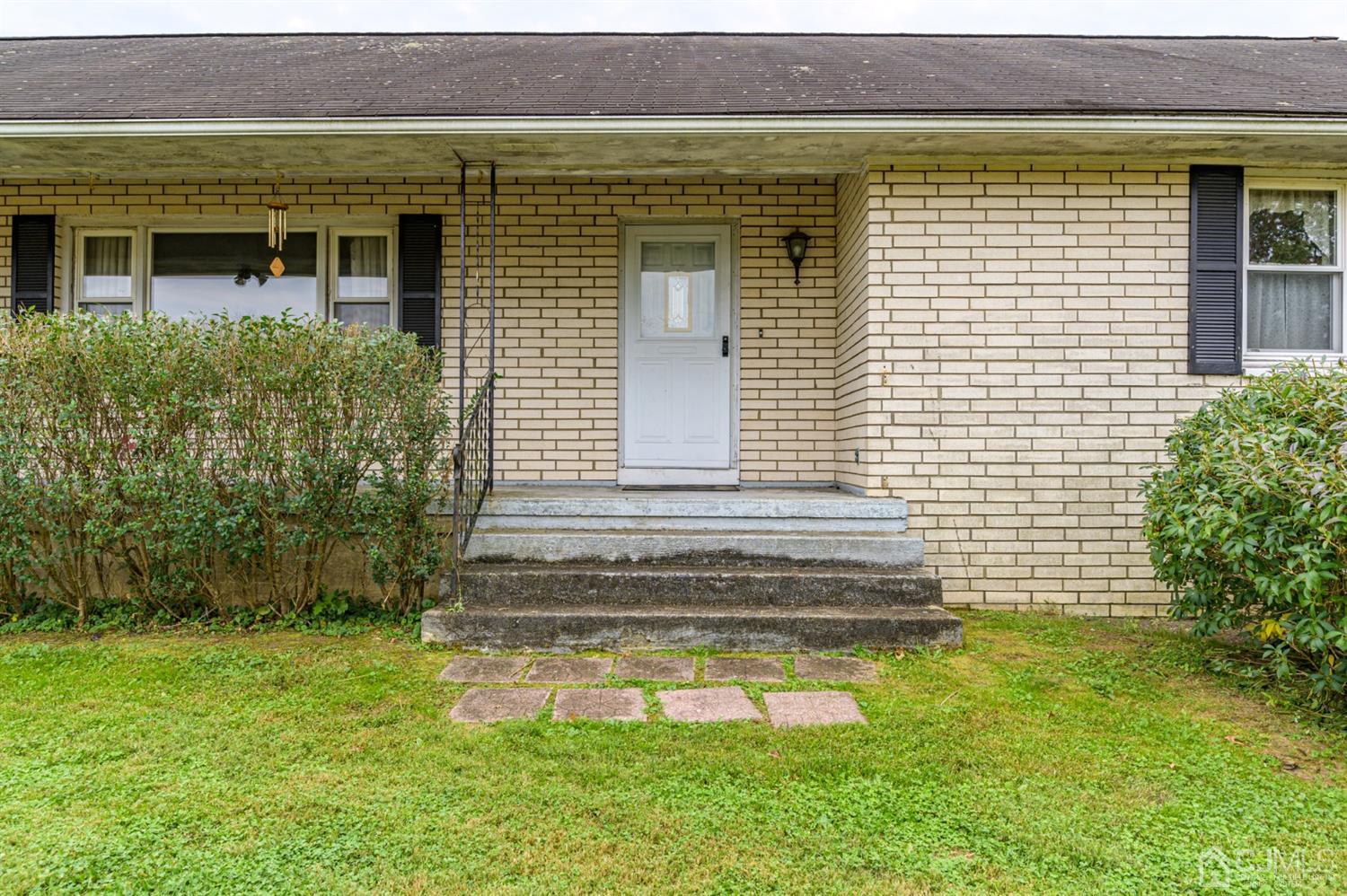 286 Barbertown Point Breeze Road Frenchtown, NJ 08825 - Photo 2 of 36 a front view of a house with a garden
