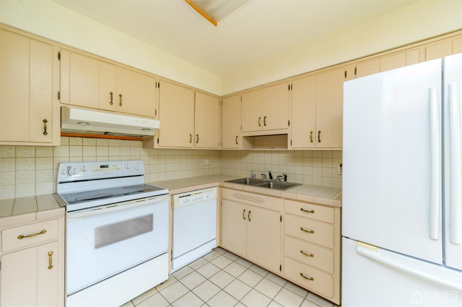 286 Barbertown Point Breeze Road Frenchtown, NJ 08825 - Photo 12 of 36 a kitchen with granite countertop white cabinets and white appliances