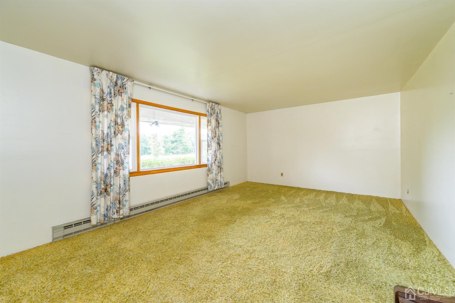 286 Barbertown Point Breeze Road Frenchtown, NJ 08825 - Photo 4 of 36 a view of an empty room with a window