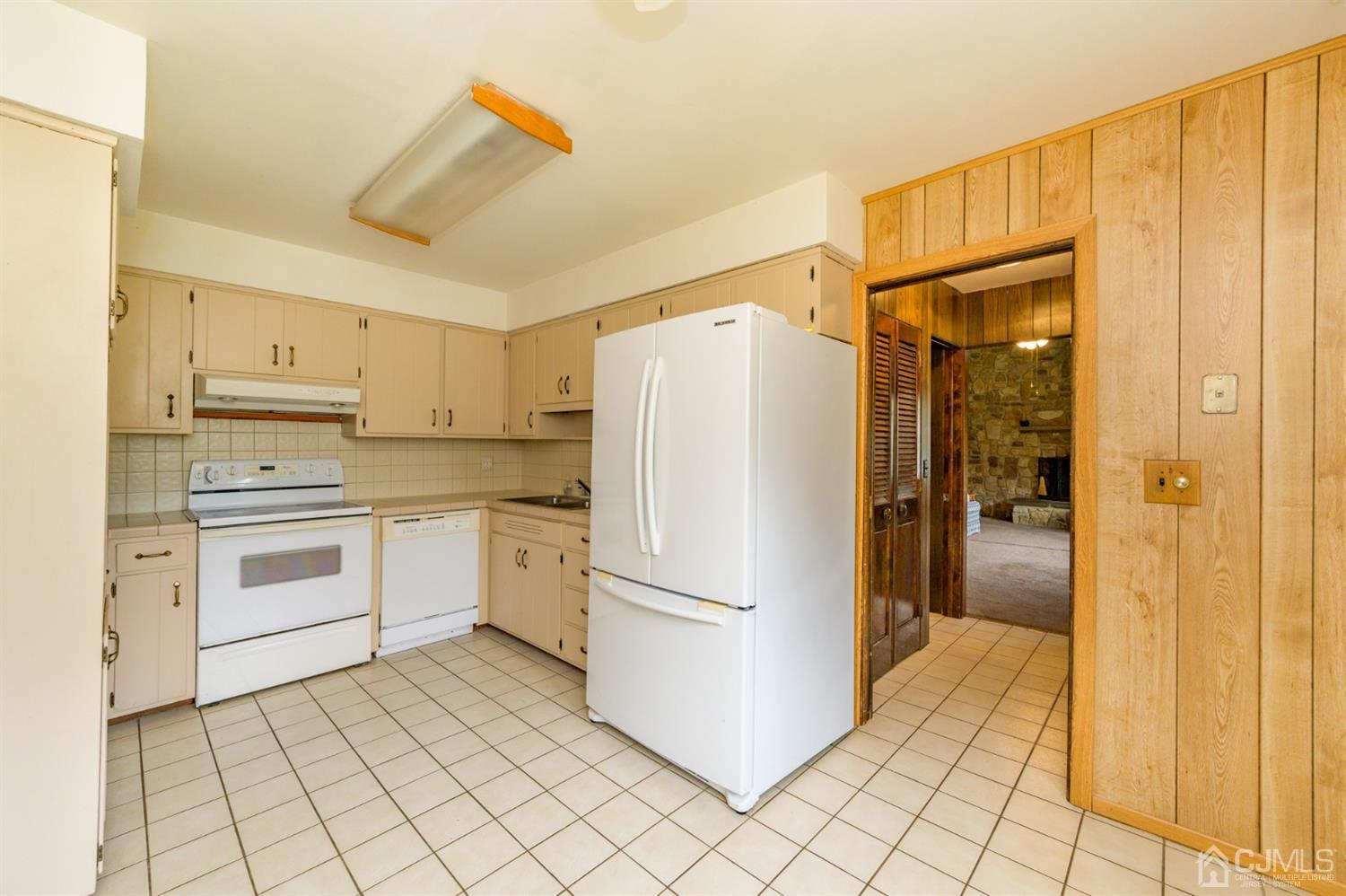 286 Barbertown Point Breeze Road Frenchtown, NJ 08825 - Photo 10 of 36 a kitchen with a refrigerator sink and cabinets