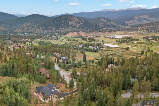a view of a town with mountains in the background