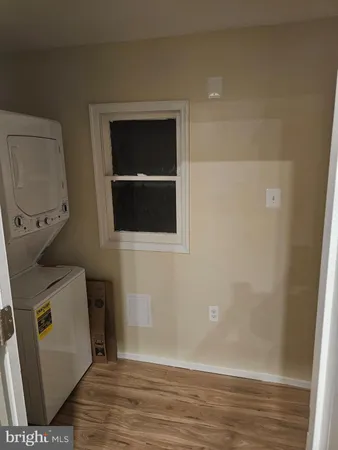 a view of a storage & utility room with empty racks