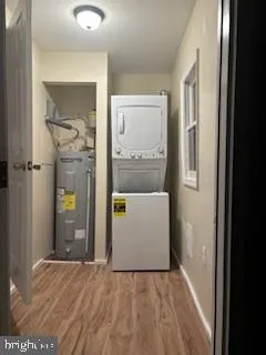 a kitchen with stainless steel appliances kitchen island granite countertop a refrigerator stove top oven and sink