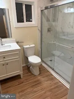 an empty room with wooden floor