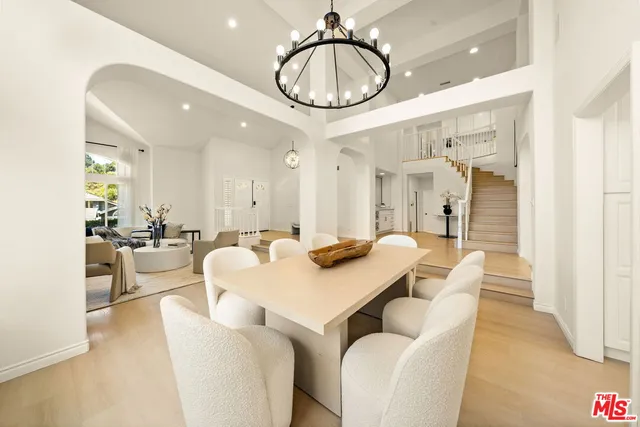 a view of entryway and hall with a living room