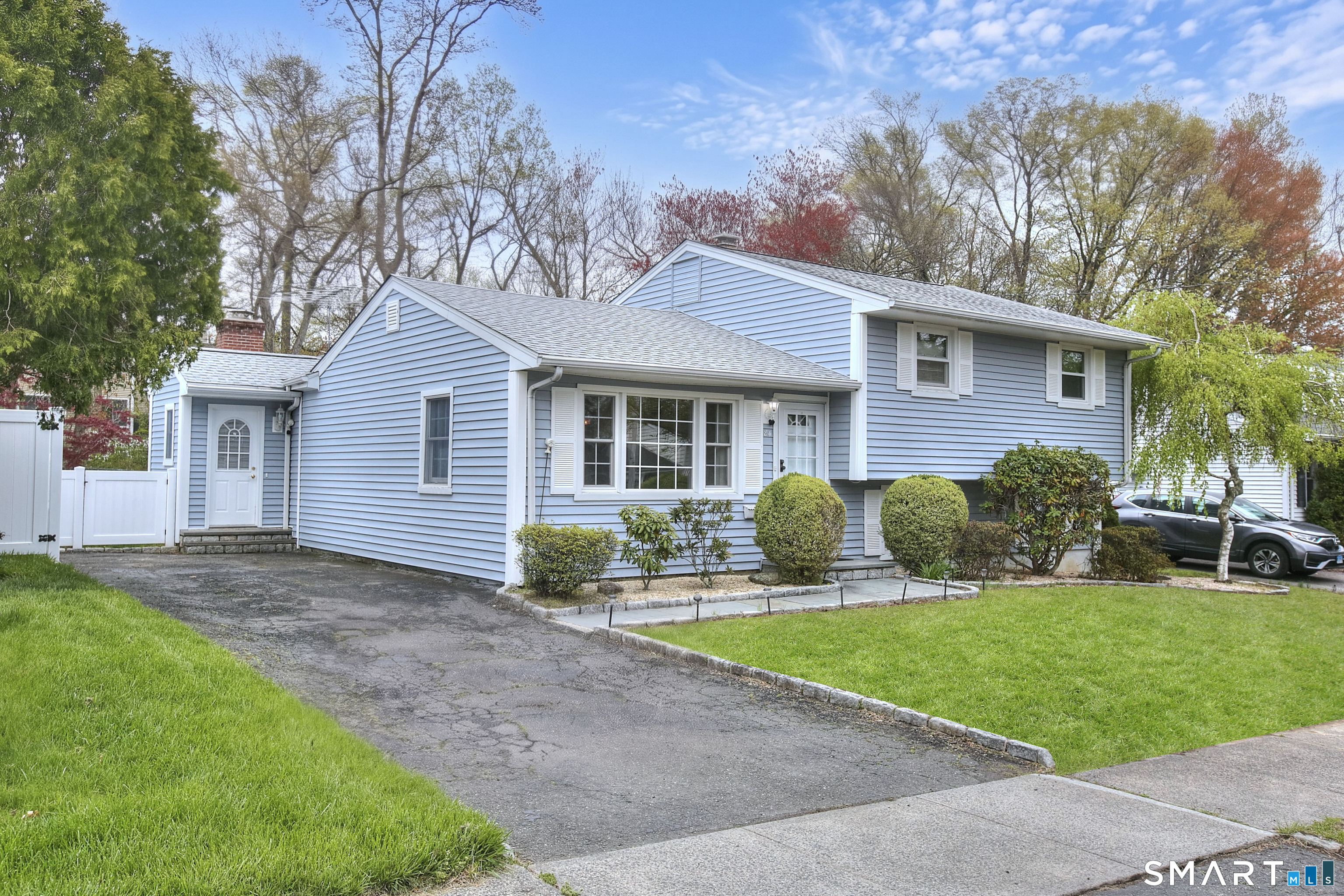 84 Youngstown Road Fairfield, CT 06824 - Photo 1 of 36 a front view of a house with a yard