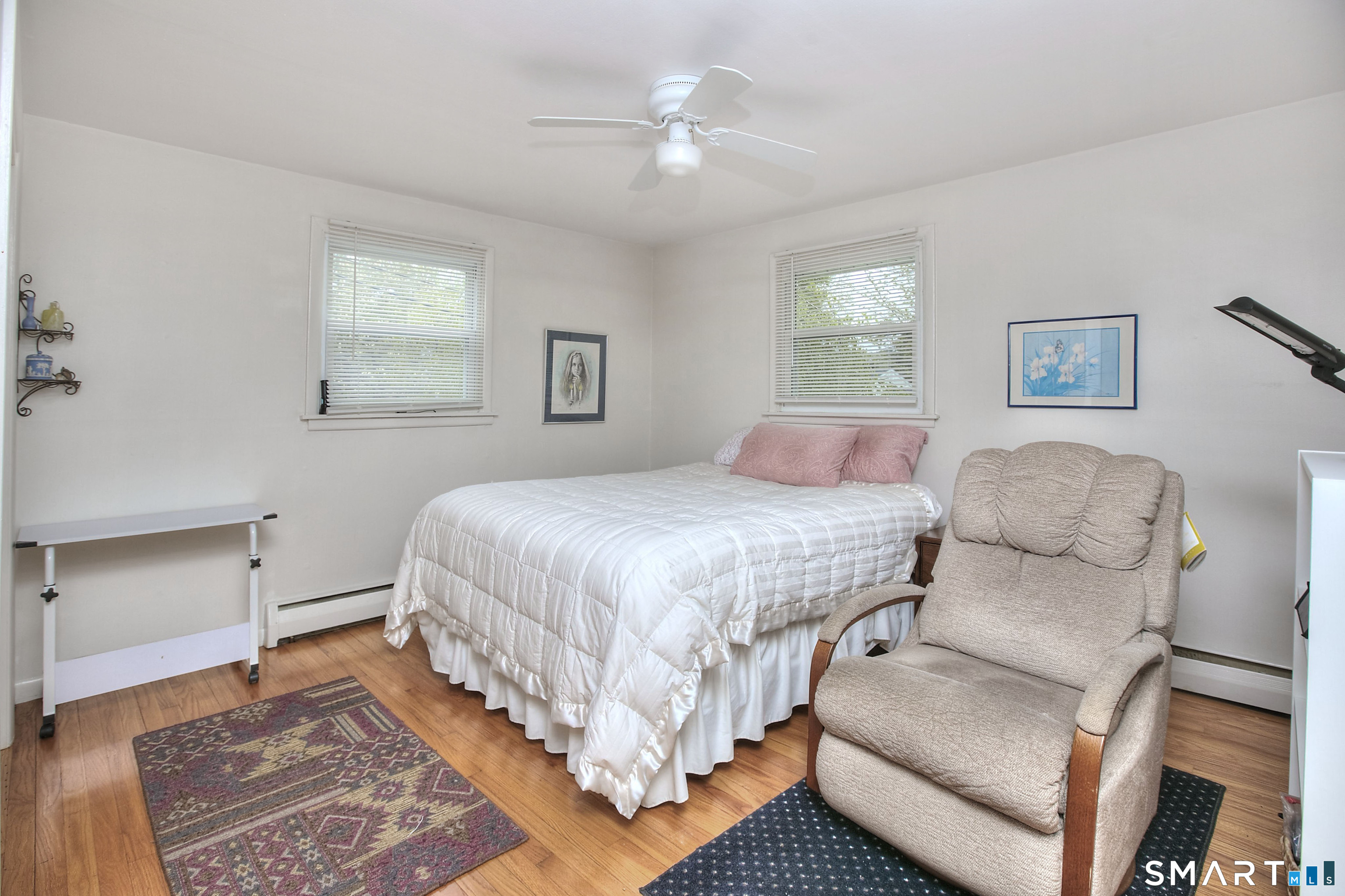 84 Youngstown Road Fairfield, CT 06824 - Photo 18 of 36 a bedroom with a large bed and a window