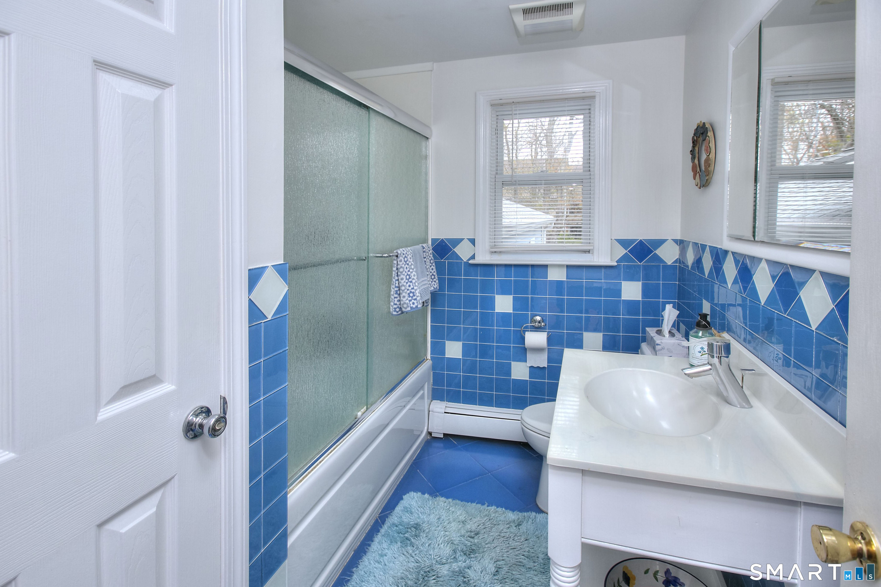 84 Youngstown Road Fairfield, CT 06824 - Photo 21 of 36 a bathroom with a sink and a mirror