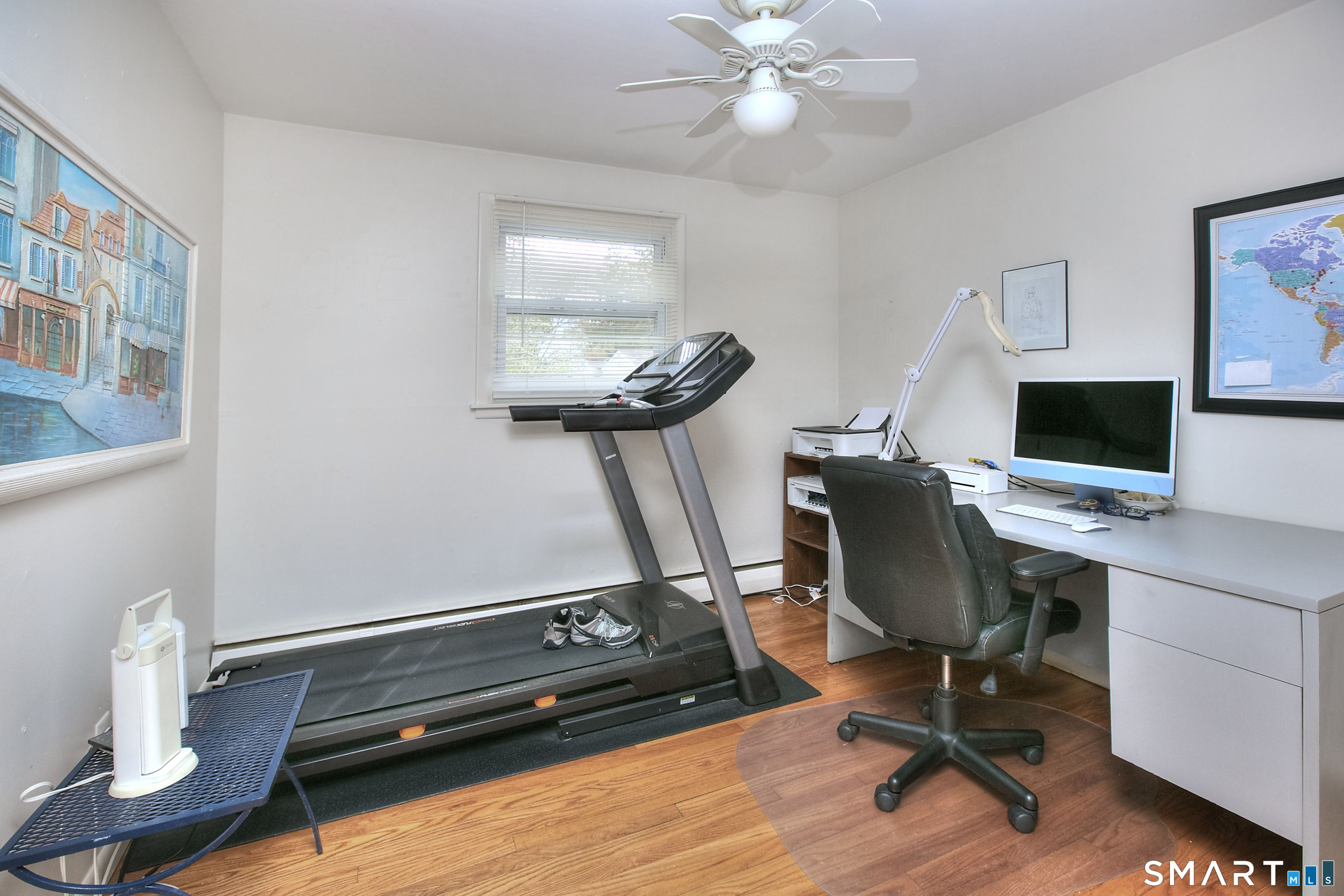 84 Youngstown Road Fairfield, CT 06824 - Photo 22 of 36 a view of a workspace with furniture and a window