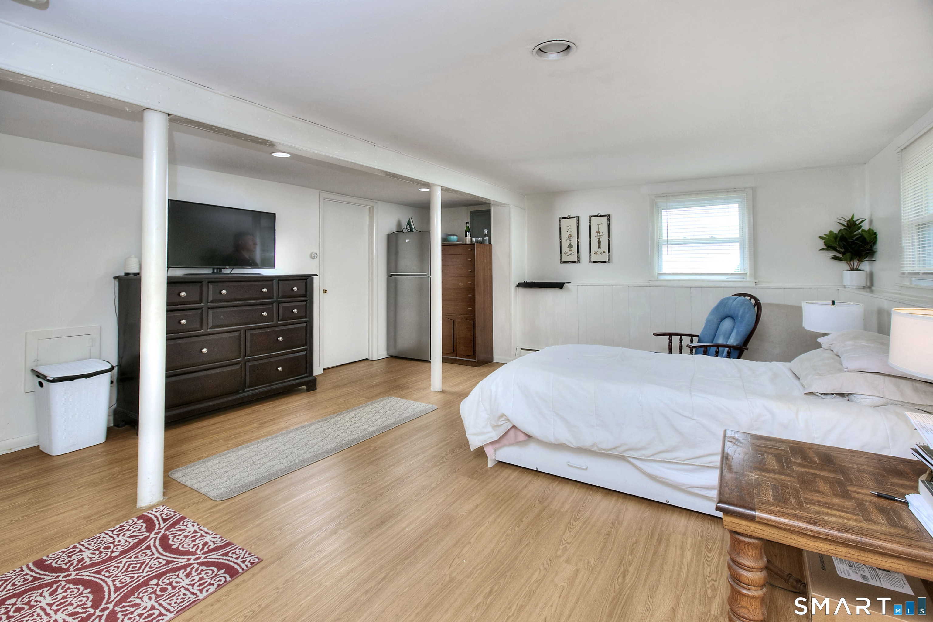 84 Youngstown Road Fairfield, CT 06824 - Photo 23 of 36 a bedroom with a bed and a television