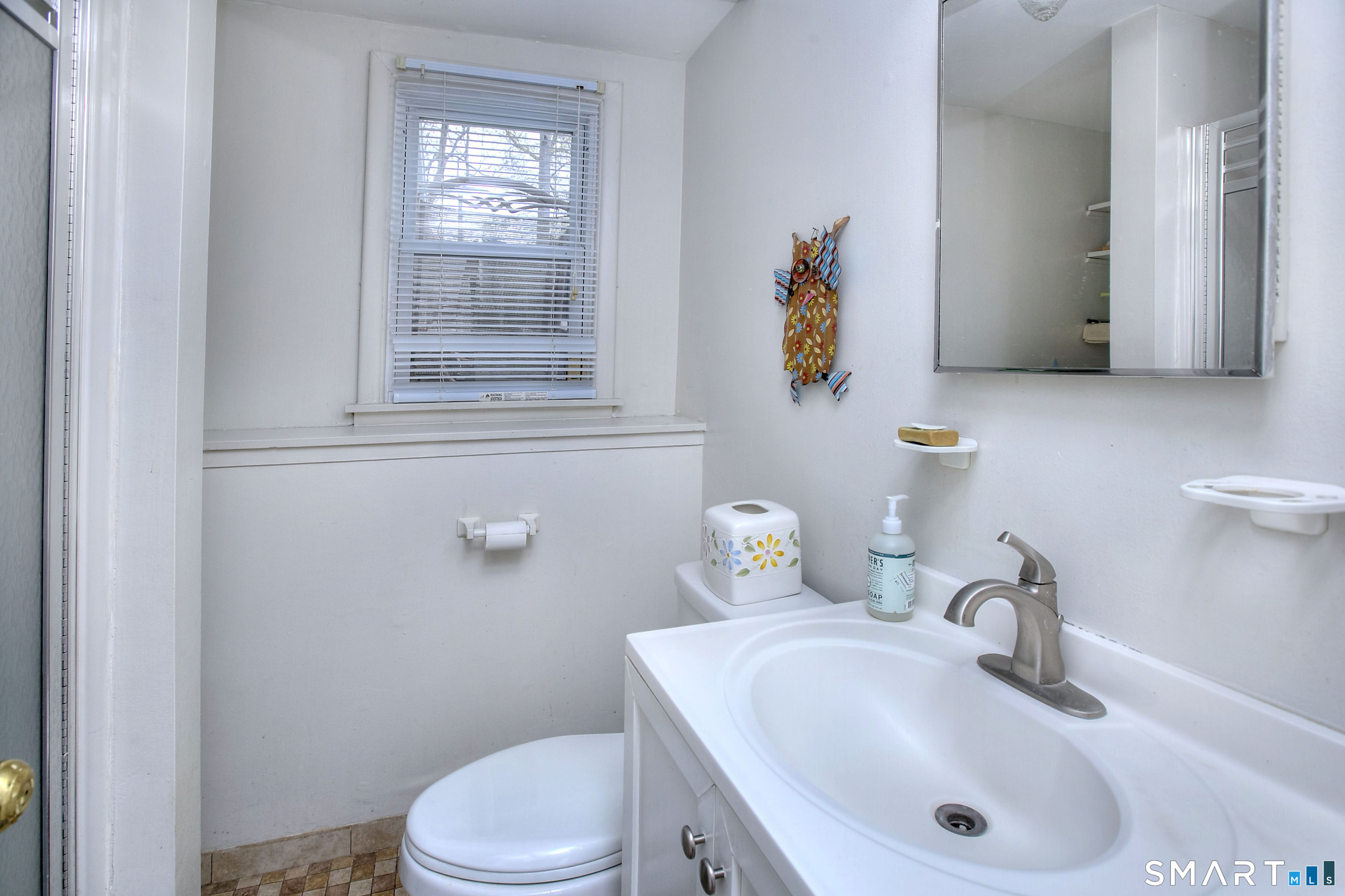 84 Youngstown Road Fairfield, CT 06824 - Photo 27 of 36 a bathroom with a sink mirror and toilet