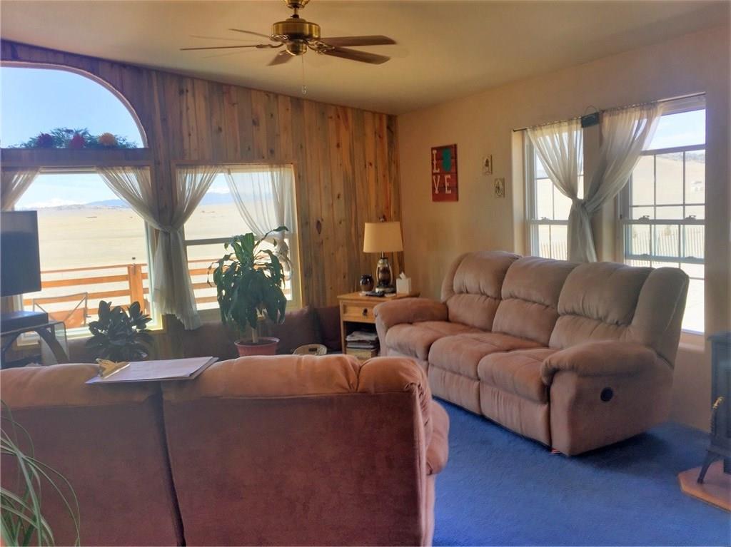 5868 Routt Road Hartsel, CO 80449 - Photo 11 of 25 a living room with furniture and a large window