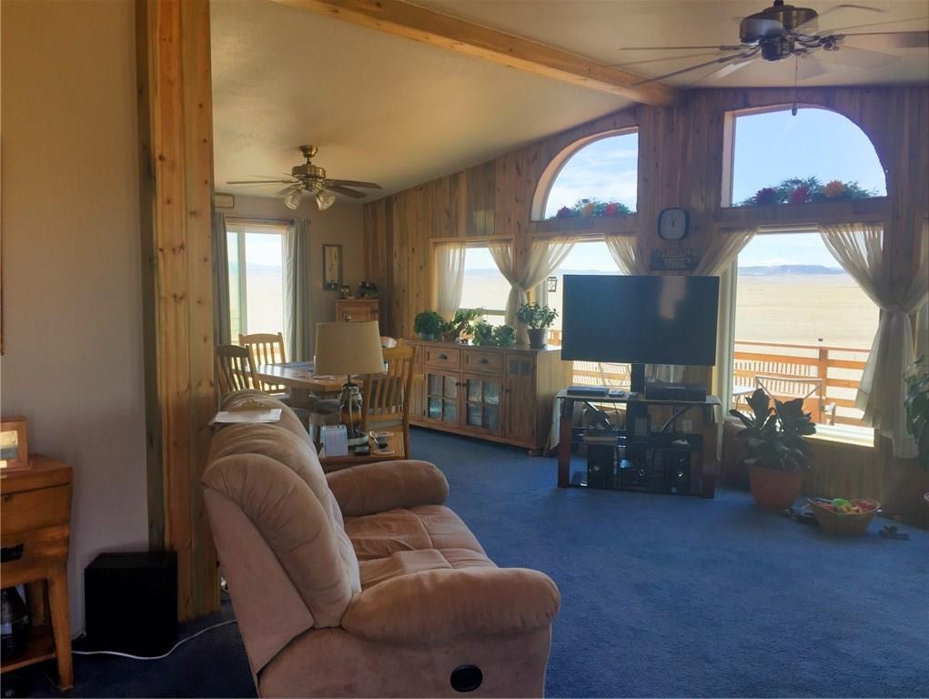 5868 Routt Road Hartsel, CO 80449 - Photo 13 of 25 a living room with furniture and a fireplace