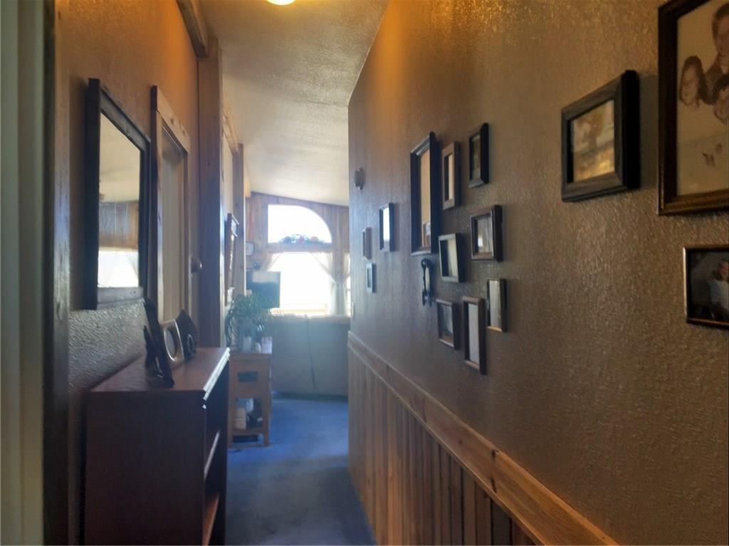 5868 Routt Road Hartsel, CO 80449 - Photo 17 of 25 a view of a hallway with workspace and living room