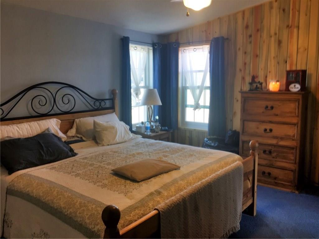 5868 Routt Road Hartsel, CO 80449 - Photo 8 of 25 a bedroom with a bed and a window