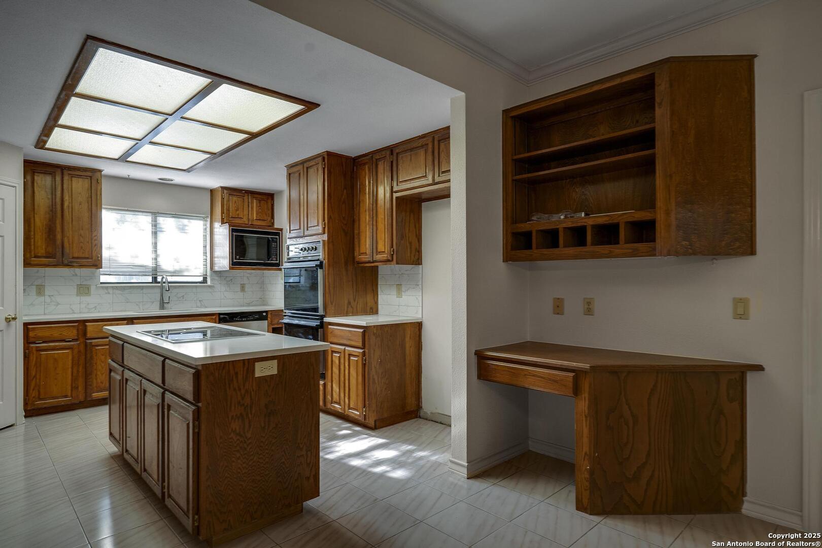 1603 Hawks Ridge Street San Antonio, TX 78248 - Photo 11 of 39 a kitchen with stainless steel appliances granite countertop a stove and a sink