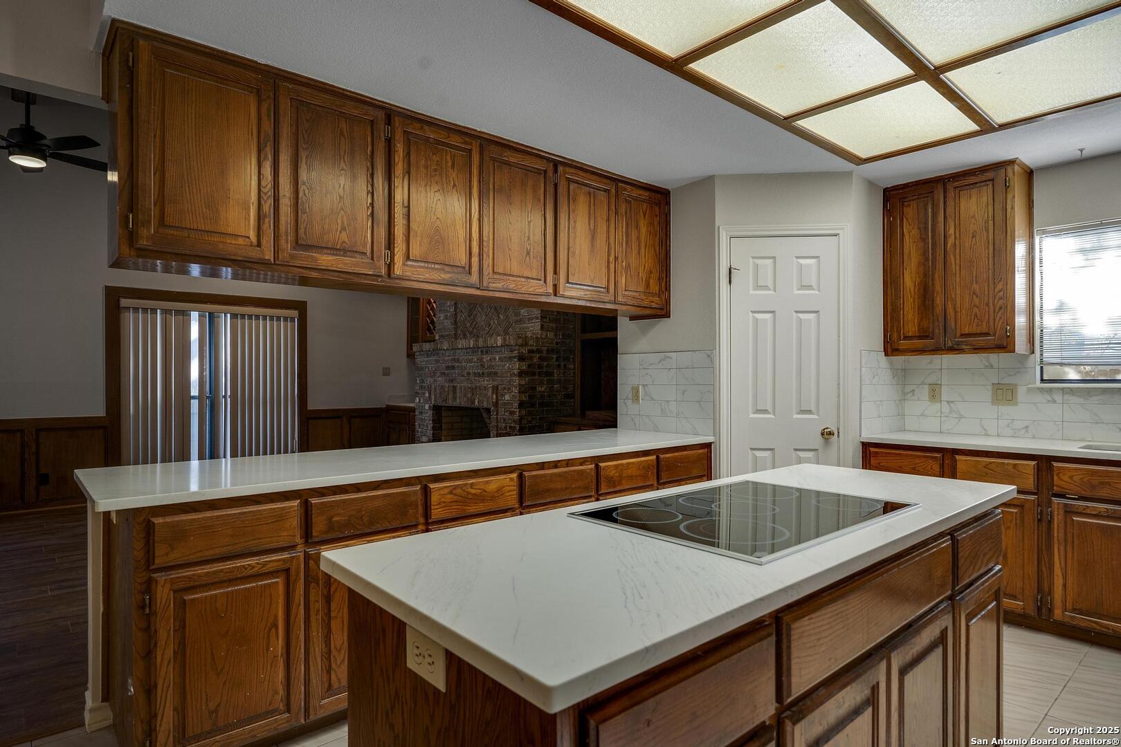 1603 Hawks Ridge Street San Antonio, TX 78248 - Photo 12 of 39 a kitchen that has a sink and a stove